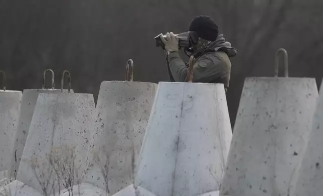 A Polish soldier at Poland's border with Russia in Dabrowka, Poland, on Saturday Nov. 30, 2024. (AP Photo/Czarek Sokolowski)