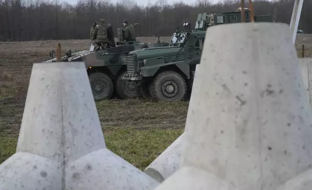 Concrete barriers that are part of Poland's East Shield fortification at Poland's border with Russia in Dabrowka, Poland, on Saturday Nov. 30, 2024. (AP Photo/Czarek Sokolowski)