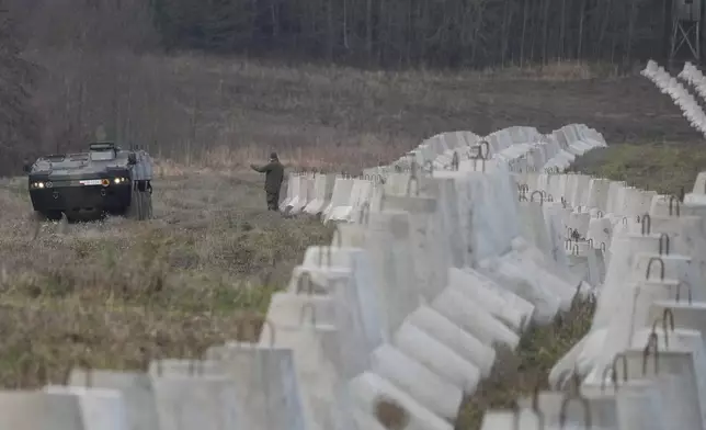 Concrete barriers that are part of Poland's East Shield fortification at Poland's border with Russia in Dabrowka, Poland, on Saturday Nov. 30, 2024. (AP Photo/Czarek Sokolowski)