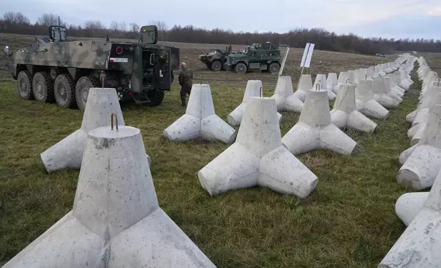 Concrete barriers that are part of Poland's East Shield fortification at Poland's border with Russia in Dabrowka, Poland, on Saturday Nov. 30, 2024. (AP Photo/Czarek Sokolowski)