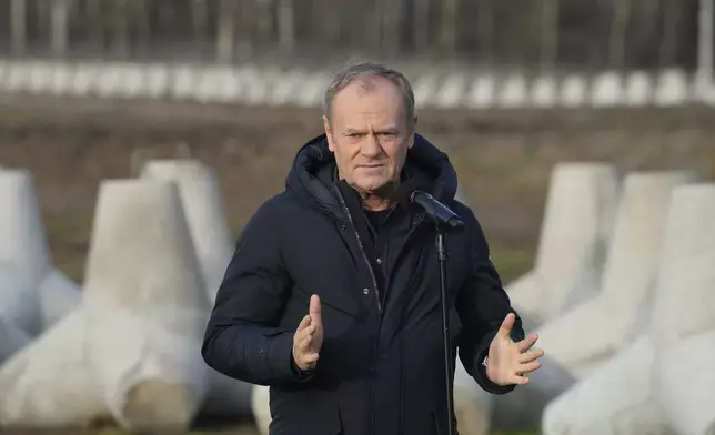 Poland's Prime Minister Donald Tusk speaks to reporters in Dabrowka, Poland, during a visit to Poland's border with Russia on Saturday Nov. 30, 2024. (AP Photo/Czarek Sokolowski)