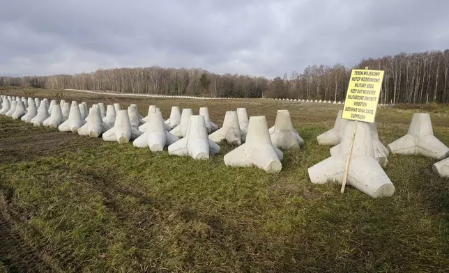 Concrete barriers that are part of Poland's East Shield fortification at Poland's border with Russia in Dabrowka, Poland, on Saturday Nov. 30, 2024. (AP Photo/Czarek Sokolowski)