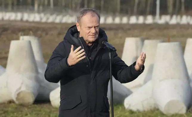 Poland's Prime Minister Donald Tusk speaks to reporters in Dabrowka, Poland, during a visit to Poland's border with Russia on Saturday Nov. 30, 2024. (AP Photo/Czarek Sokolowski)