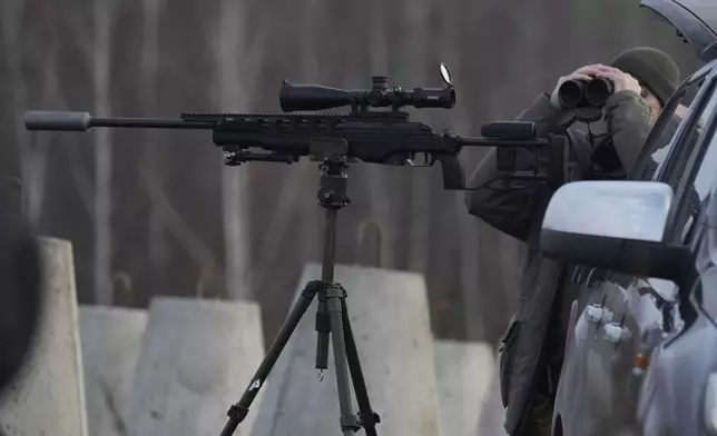 A Polish soldier at Poland's border with Russia in Dabrowka, Poland, on Saturday Nov. 30, 2024. (AP Photo/Czarek Sokolowski)