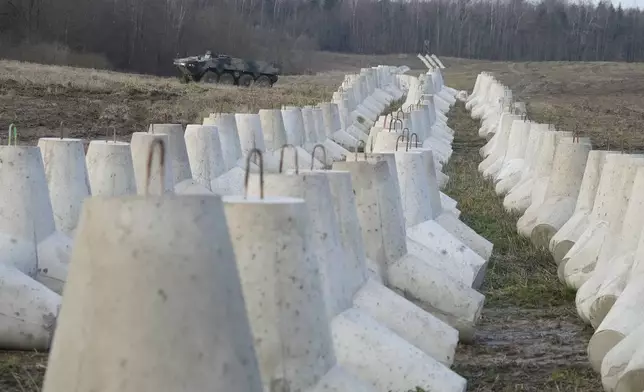 Concrete barriers that are part of Poland's East Shield fortification at Poland's border with Russia in Dabrowka, Poland, on Saturday Nov. 30, 2024. (AP Photo/Czarek Sokolowski)