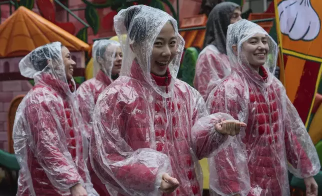 Performers walk down Sixth Avenue during the Macy's Thanksgiving Day Parade, Thursday, Nov. 28, 2024, in New York. (AP Photo/Julia Demaree Nikhinson)