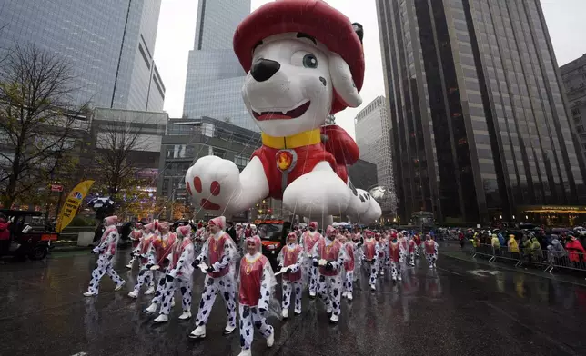 The Marshall from PAW Patrol balloon floats in the Macy's Thanksgiving Day Parade, Thursday, Nov. 28, 2024, in New York. (Photo by Charles Sykes/Invision/AP)