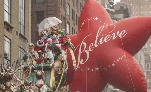 Santa Claus is seen along Central Park West during the Macy's Thanksgiving Day Parade, Thursday, Nov. 28, 2024, in New York. (AP Photo/Yuki Iwamura)