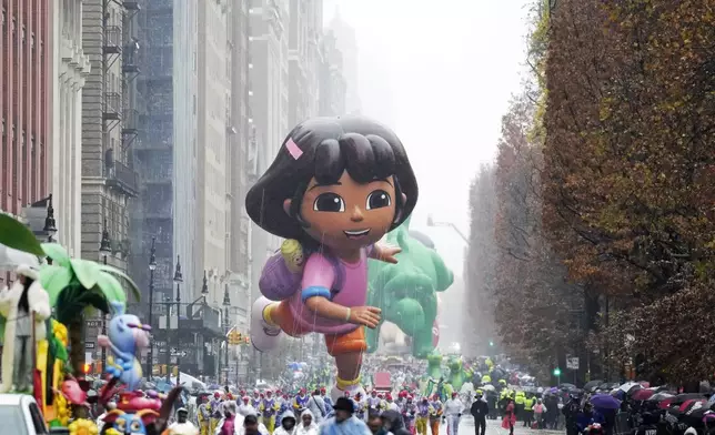 The Dora the Explorer balloon floats in the Macy's Thanksgiving Day Parade, Thursday, Nov. 28, 2024, in New York. (Photo by Charles Sykes/Invision/AP)