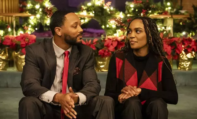 This image released by BET+ shows Romeo Miller, left, and China Anne McClain in a scene from “Brewster's Millions: Christmas." (BET+ via AP)