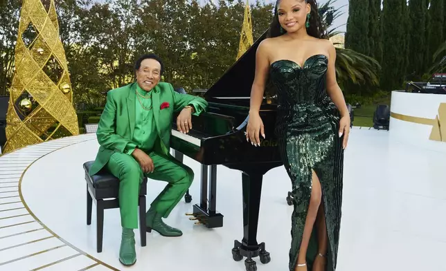 This promotional image released by NBC shows Smokey Robinson, left, and Halle Bailey, who will host the holiday special "A Motown Christmas." (NBCUniversal via AP)