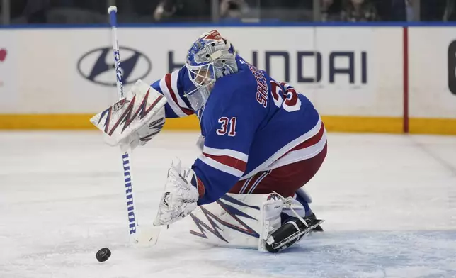 New York Rangers goaltender Igor Shesterkin defends the goal during the first period of an NHL hockey game against the San Jose Sharks, Thursday, Nov. 14, 2024, in New York. (AP Photo/Seth Wenig)