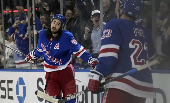 New York Rangers' Mika Zibanejad, left, celebrates his goal with Adam Fox during the second period of an NHL hockey game against the San Jose Sharks, Thursday, Nov. 14, 2024, in New York. (AP Photo/Seth Wenig)