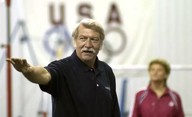 FILE - Bela Karolyi speaks during the opening of his training center for the U.S. gymnastics women's national team in Huntsville, Texas, May 19, 2003. (Travis Bartoshek/The Huntsville Item via AP, File)