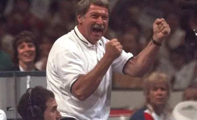 FILE - Bela Karolyi reacts with joy as his gymnastics student Kerri Strug finishes a nice routine on the balance beam during the optional portion of the U.S. Olympic Trials in gymnastics, June 30, 1996, in Boston. (AP Photo/Elise Amendola, File)