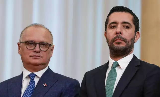 A March 21, 2023 photo of Serbian ministers Goran Vesic, left, and Tomislav Momirovic in Belgrade, Serbia. (AP Photo/Darko Vojinovic)