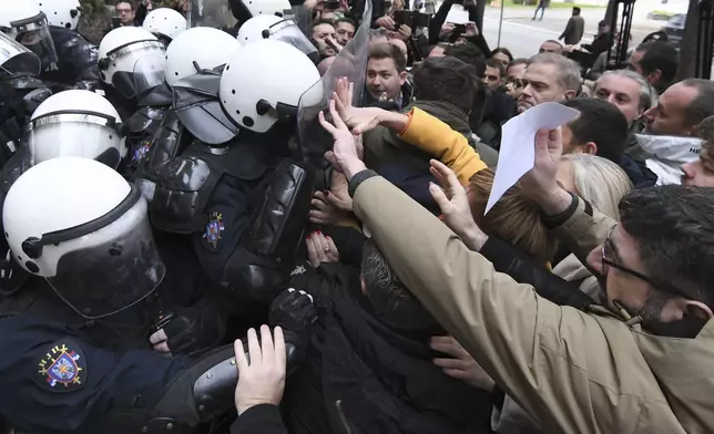 Skirmishes between Serbian police and opposition protesters demanding arrests over a deadly roof collapse at a railway station in Novi Sad, Serbia, Wednesday, Nov. 20, 2024. (AP Photo)