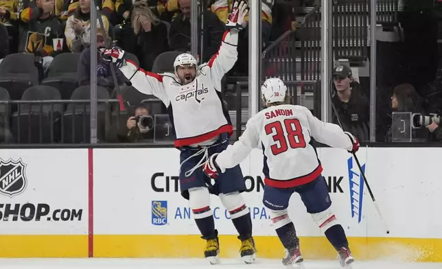 Washington Capitals left wing Alex Ovechkin (8) celebrates after scoring against the Vegas Golden Knights during the second period of an NHL hockey game Sunday, Nov. 17, 2024, in Las Vegas. (AP Photo/John Locher)