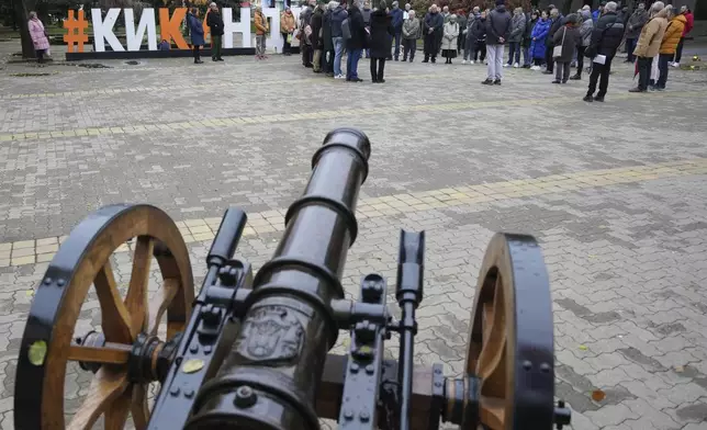 People stand in silence to commemorate the 15 victims of a railway roof collapse one month ago and demand accountability for the tragedy in Kikinda, Serbia, Friday, Nov. 29, 2024. (AP Photo/Darko Vojinovic)