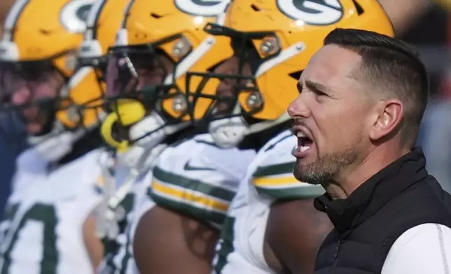 Green Bay Packers head coach Matt LaFleur argues a call during the first half of an NFL football game against the Chicago Bears Sunday, Nov. 17, 2024, in Chicago. (AP Photo/Charles Rex Arbogast)