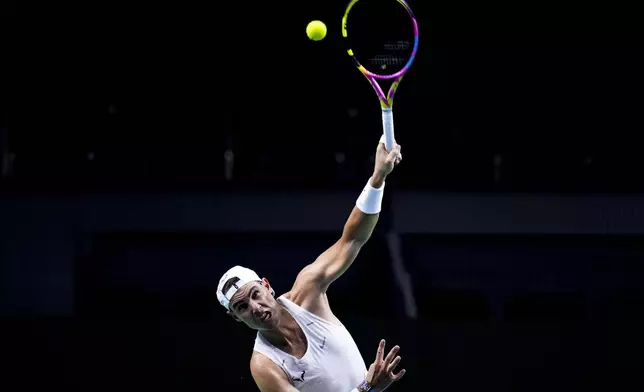 Spain's tennis player Rafael Nadal takes part in a training session at the Martin Carpena Sports Hall, in Malaga, southern Spain, on Friday, Nov. 15, 2024. (AP Photo/Manu Fernandez)