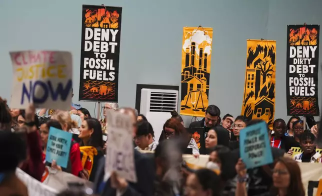 Activists participate in a demonstration against fossil fuels at the COP29 U.N. Climate Summit, Saturday, Nov. 16, 2024, in Baku, Azerbaijan. (AP Photo/Peter Dejong)