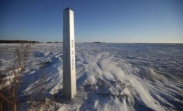 FILE - A border marker, between the United States and Canada is shown just outside of Emerson, Manitoba, on Thursday, Jan. 20, 2022. (John Woods/The Canadian Press via AP, File)