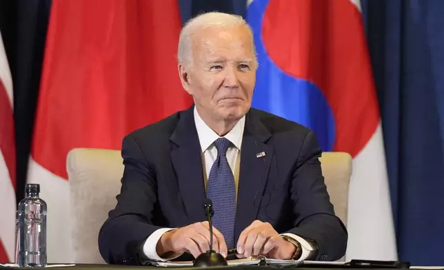 President Joe Biden listens during a trilateral meeting with the Prime Minister of Japan Shigeru Ishiba and the President of South Korea Yoon Suk Yeol in Lima, Peru, Friday, Nov. 15, 2024. (AP Photo/Manuel Balce Ceneta)