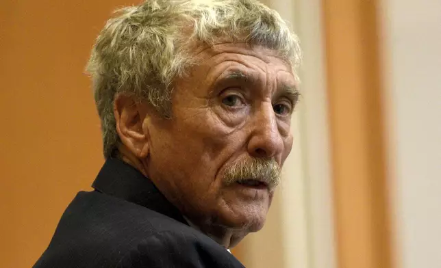 Defendant Bradley Asbury, accused of holding down a teenage boy so colleagues could rape him at a New Hampshire youth center in the 1990s, looks behind him while seated at the defendant's table during opening statements for his trial at Hillsborough County Superior Court in Manchester, N.H.,, Tuesday, Nov. 19, 2024. (David Lane/Union Leader via AP, Pool)