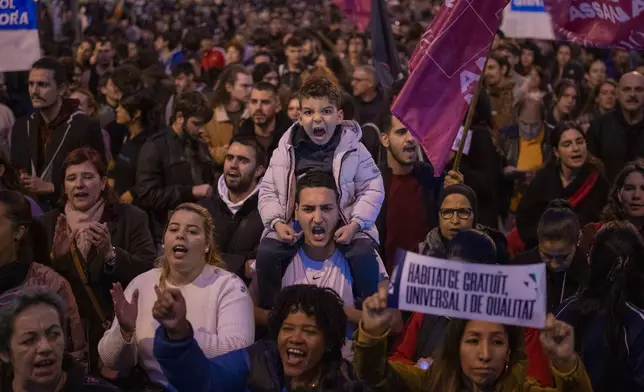 Demonstrators march to protest the skyrocketing cost of renting an apartment in Barcelona, Spain, Saturday, Nov. 23, 2024. (AP Photo/Emilio Morenatti)