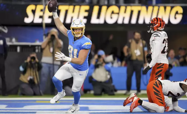 Los Angeles Chargers tight end Will Dissly (81) celebrates his touchdown catch during the first half of an NFL football game against the Cincinnati Bengals, Sunday, Nov. 17, 2024, in Inglewood, Calif. (AP Photo/Eric Thayer)