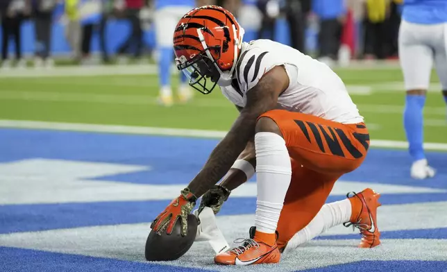 Cincinnati Bengals wide receiver Ja'Marr Chase (1) celebrates his touchdown catch during the second half of an NFL football game against the Los Angeles Chargers, Sunday, Nov. 17, 2024, in Inglewood, Calif. (AP Photo/Eric Thayer)