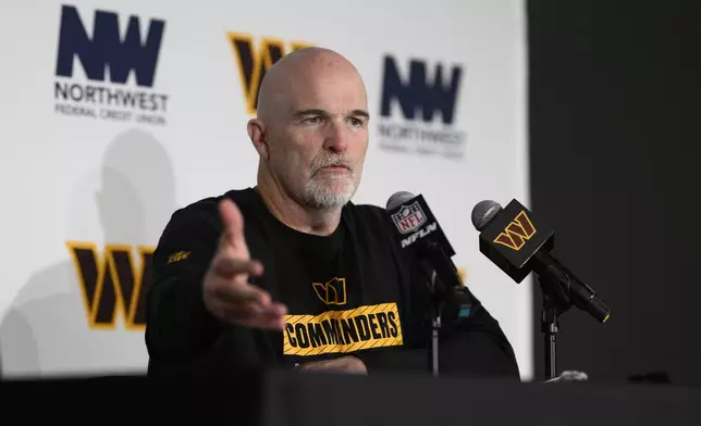 Washington Commanders head coach Dan Quinn answers questions during a press conference after an NFL football game against the Dallas Cowboys, Sunday, Nov. 24, 2024, in Landover, Md. The Cowboys won 34-26. (AP Photo/Nick Wass)