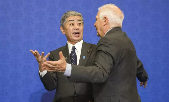 Japanese Foreign Minister Takeshi Iwaya, left, talks to European Union foreign policy chief Josep Borrell after a family photo at the G7 of foreign Ministers in Fiuggi, some 70 kilometers south-east of Rome, Tuesday, Nov. 26, 2024. (AP Photo/Alessandra Tarantino, Pool)