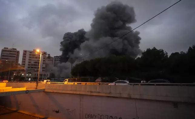 Smoke rise from an Israeli airstrike in Tayouneh, Beirut, Lebanon, Monday, Nov. 25, 2024. (AP Photo/Hassan Ammar)