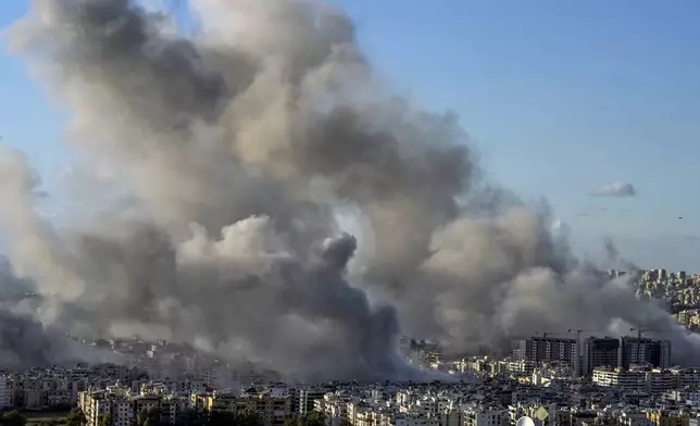 Smoke rises following an Israeli airstrike on Dahiyeh, in Beirut, Lebanon, Tuesday, Nov. 26, 2024. (AP Photo/Bilal Hussein)