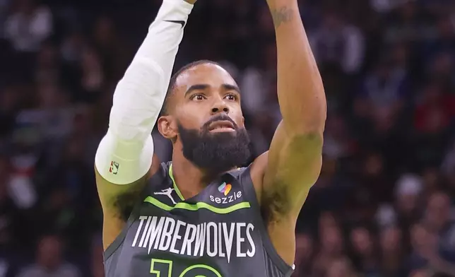 Minnesota Timberwolves guard Mike Conley shoots against the Los Angeles Clippers in the first quarter of an Emirates NBA Cup basketball game Friday, Nov. 29, 2024, in Minneapolis. (AP Photo/Bruce Kluckhohn)