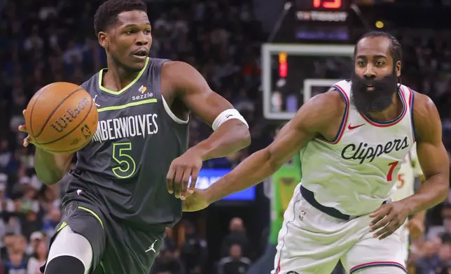 Minnesota Timberwolves guard Anthony Edwards (5) works around Los Angeles Clippers guard James Harden (1) in the first quarter of an Emirates NBA Cup basketball game Friday, Nov. 29, 2024, in Minneapolis. (AP Photo/Bruce Kluckhohn)