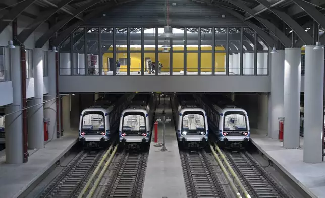 Metro wagons are parked at the newly built Pylaia depot ahead of its Nov. 30 official opening, in Thessaloniki, northern Greece, Friday, Nov. 22, 2024 – part of the city's long-delayed subway system showcasing archaeological finds from decades of construction. (AP Photo/Giannis Papanikos)