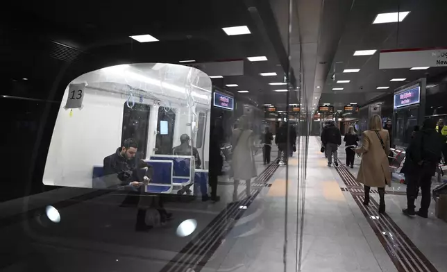 The newly built New Railway Station metro station ahead of its Nov. 30 official opening, in Thessaloniki, northern Greece, Friday, Nov. 22, 2024 – part of the city's long-delayed subway system showcasing archaeological finds from decades of construction. (AP Photo/Giannis Papanikos)