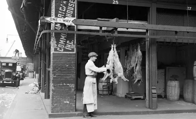 This 1937 image from the New York City Municipal Archives shows the Chicken Market, part of New York's Meatpacking District. (New York City Municipal Archives via AP)