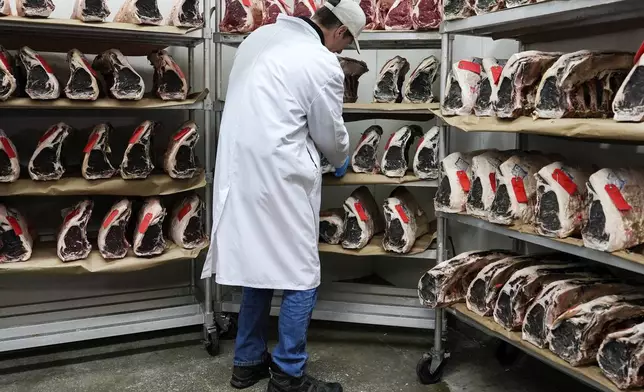 John Jobbagy shows dry aged beef during an interview at J.T. Jobbagy Inc. in the Meatpacking District of Manhattan, Tuesday, Nov. 19, 2024, in New York. (AP Photo/Julia Demaree Nikhinson)