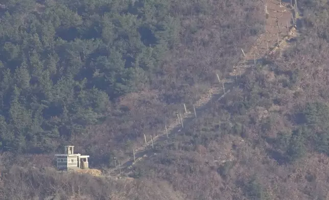 A North Korean soldier stands at a North Korean military guard post, seen from Gimpo, South Korea, Friday, Nov. 29, 2024. (AP Photo/Lee Jin-man)