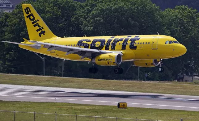 FILE - A Spirit Airlines 319 Airbus lands at Manchester Boston Regional Airport on June 2, 2023, in Manchester, N.H. (AP Photo/Charles Krupa, File)