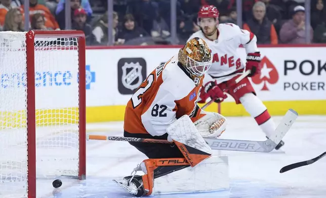 Philadelphia Flyers' Ivan Fedotov cannot stop a goal by Carolina Hurricanes' Sebastian Aho during the third period of an NHL hockey game, Wednesday, Nov. 20, 2024, in Philadelphia. (AP Photo/Matt Slocum)