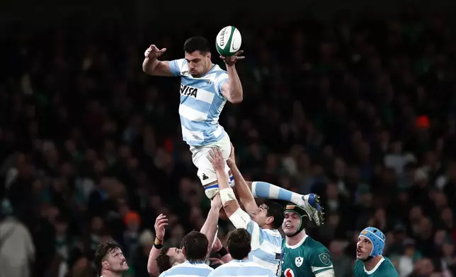 Argentina's Guido Petti, top, jumps for the ball during the Autumn Nations series rugby union match between Ireland and Argentina, at Aviva Stadium, Dublin, Ireland, Friday, Nov. 15, 2024. (AP Photo/Peter Morrison)