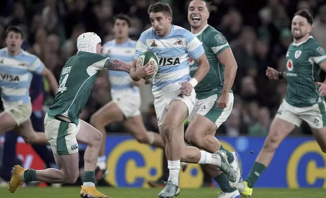 Argentina's Juan Cruz Mallia races through to score his side's first try of the game during the Autumn Nations series rugby union match between Ireland and Argentina, at Aviva Stadium, Dublin, Ireland, Friday, Nov. 15, 2024. (Brian Lawless//PA via AP)