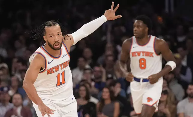 New York Knicks' Jalen Brunson reacts after hitting a three-point basket during the first half of an NBA basketball game against the Washington Wizards, Monday, Nov. 18, 2024, in New York. (AP Photo/Seth Wenig)