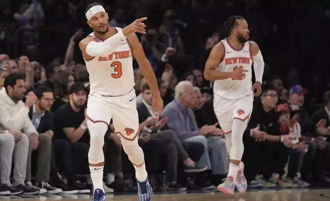 New York Knicks' Josh Hart reacts after hitting a shot during the first half of an NBA basketball game against the Washington Wizards, Monday, Nov. 18, 2024, in New York. (AP Photo/Seth Wenig)