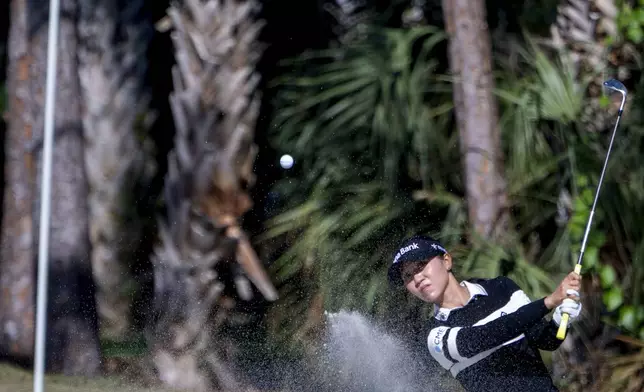 Jean Thitkul hits from the rough on the sixth green during the first round of the LPGA CME Group Tour Championship golf tournament Thursday, Nov. 21, 2024, in Naples, Fla. (AP Photo/Chris Tilley)